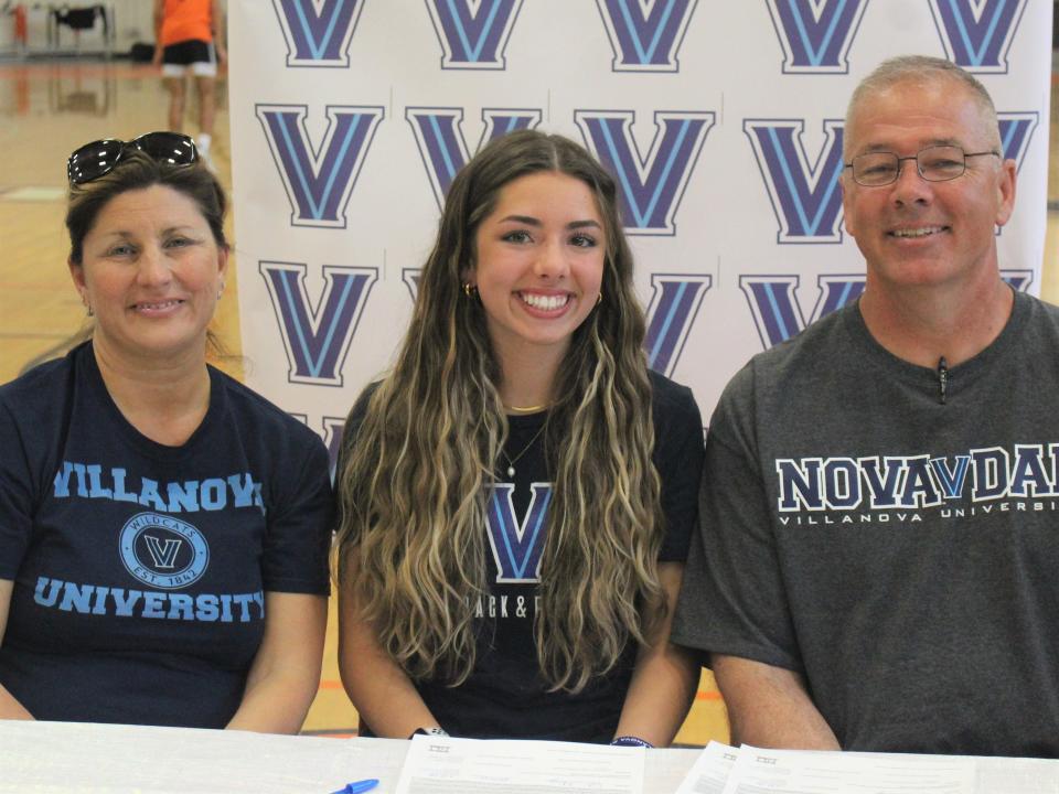 From left to right: Crystal O'Leary, Caelen O'Leary and Brian O'Leary are all smiles as Caelen committed to Villanova University in a signing ceremony at Taunton High School.