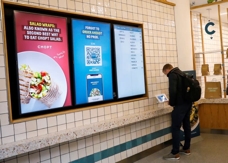 A customer places an order at the newest Chopt Creative Salad Co., location in New York