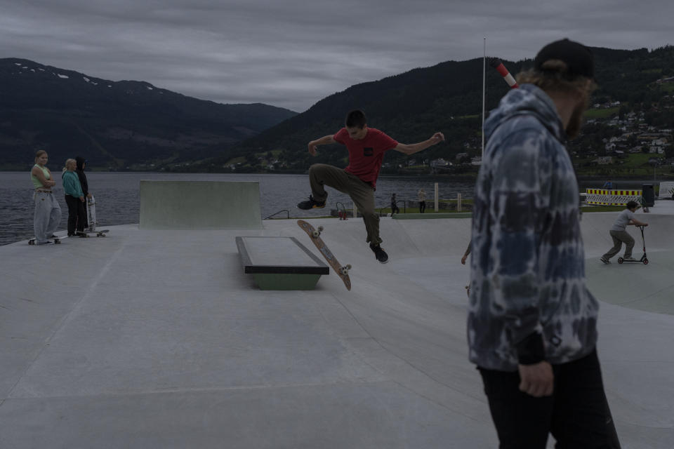 People skateboard in the town of Voss, Norway, on Aug. 8, 2022. (AP Photo/Bram Janssen)