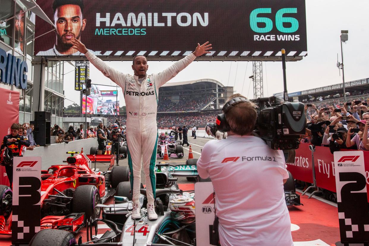 Praise be: Lewis Hamilton celebrates after his remarkable victory at the Hockenheimring