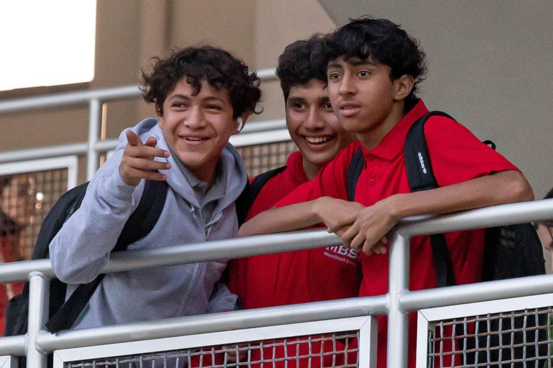 Students watch others enter campus on the first day of school at Miami Beach Senior High, 2231 Prairie Ave., in Miami Beach, Florida, on Wednesday, Aug. 17, 2022.