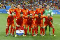 Netherlands players pose before the 2014 World Cup quarter-finals between Costa Rica and the Netherlands at the Fonte Nova arena in Salvador July 5, 2014. REUTERS/Paul Hanna