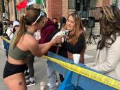 Sarah Bohan (left) hands the kitten to a kind spectator.