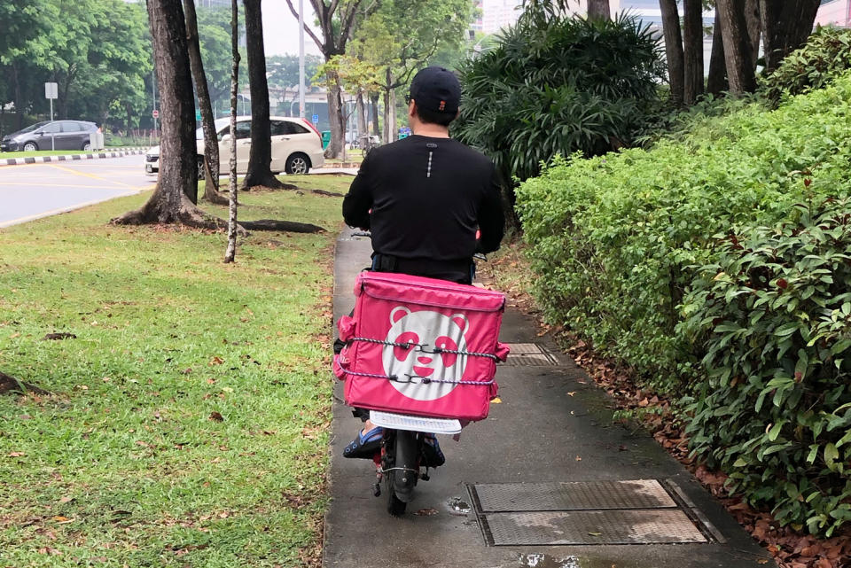 A Foodpanda delivery rider on an e-scooter seen along Jurong East Street 21 on 5 November 2019. (PHOTO: Dhany Osman / Yahoo News Singapore)