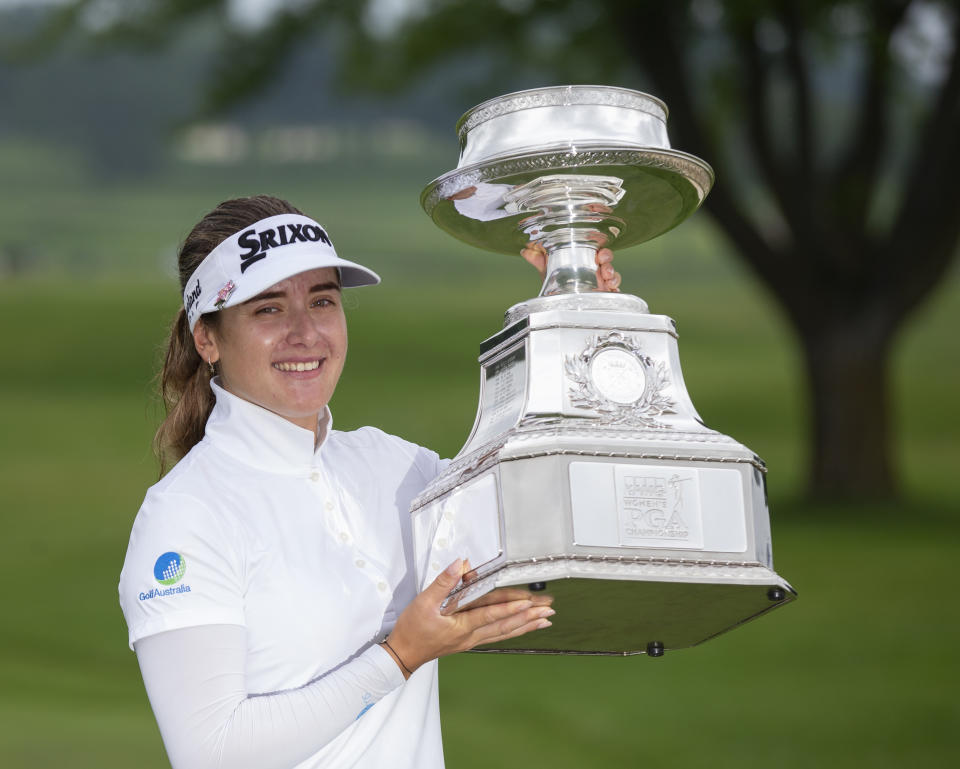 Hannah Green, of Australia, holds the trophy after winning the KPMG Women's PGA Championship golf tournament, Sunday, June 23, 2019, in Chaska, Minn. (AP Photo/Andy Clayton-King)