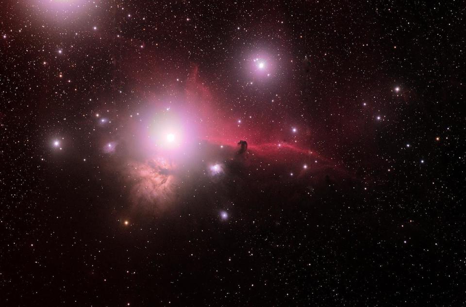A widefield view of the Flame (NGC2024) and Horsehead (IC434) Nebulae in Orion, captured in December by astrophotographer <a href="https://www.flickr.com/photos/16590526@N07/" target="_blank">Roger Hutchinson</a>. The pair are approximately 900 to 1,500 light years away.
