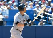 Aug 15, 2015; Toronto, Ontario, CAN; New York Yankees right fielder Carlos Beltran (36) hits a double against Toronto Blue Jays in the eighth inning at Rogers Centre. Dan Hamilton-USA TODAY Sports