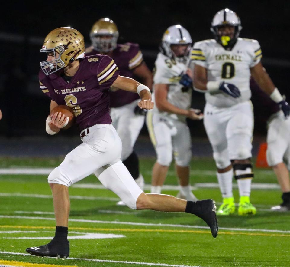 St. Elizabeth's Gavin Andrews carries in the second quarter of Tatnall's 41-6 win, Thursday, Oct. 26, 2023 at Abessinio Stadium.