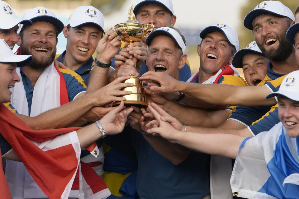 The Europe team led by Europe's Team Captain Luke Donald, center, lift the Ryder Cup after winning it at the Marco Simone Golf Club in Guidonia Montecelio, Italy, Sunday, Oct. 1, 2023. (AP Photo/Alessandra Tarantino)