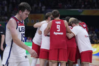 U.S. guard Austin Reaves, left, walks off the court after losing to Germany in a Basketball World Cup semi final game in Manila, Philippines, Friday, Sept. 8, 2023. (AP Photo/Michael Conroy)