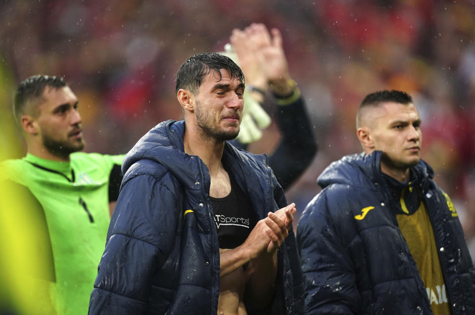 Ukraine's Roman Yaremchuk applauds the fans following the World Cup 2022 play-off final soccer match at Cardiff City Stadium, Cardiff, Wales, Sunday June 5, 2022. Wales won 1-0. (Mike Egerton/PA via AP)