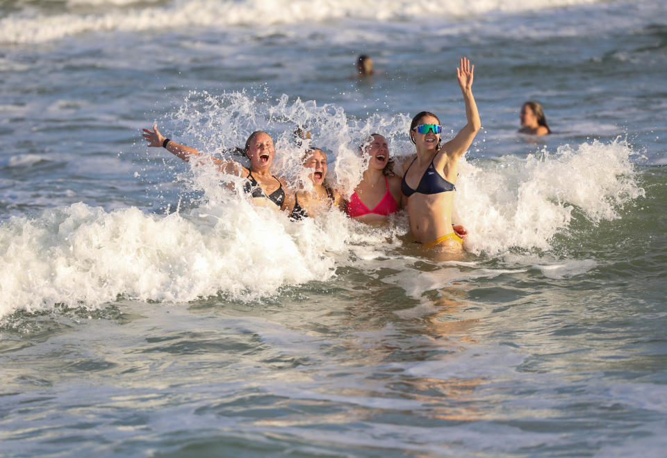 Tennessee swimmers enjoy the waves at Wrightsville Beach, North Carolina on the program's annual bonding trip, which started because of UT swimming and diving director Matt Kredich's son, Ben.