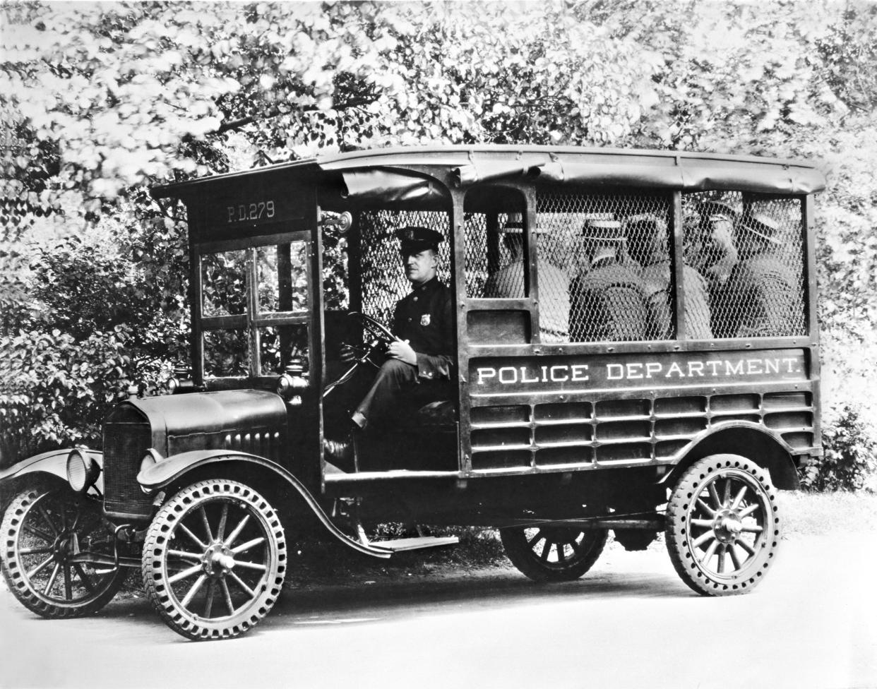 A 1925 Ford Model T used as a police transport wagon.