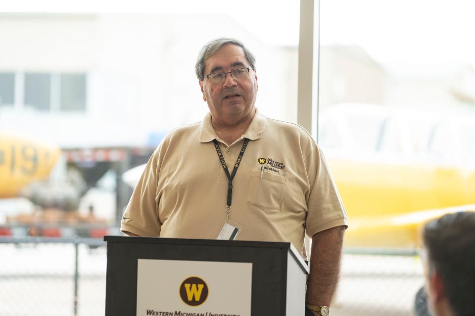 WMU College of Aviation Dean Raymond Thompson speaks during the dedication of two T-34 aircraft to the Hooligans Flight Team at Western Michigan University's College of Aviation in Battle Creek on Friday, Dec. 2, 2022.