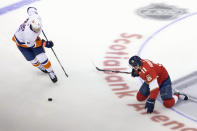 New York Islanders defenseman Ryan Pulock (6) moves the puck around Florida Panthers left wing Jonathan Huberdeau (11) during the first period NHL Stanley Cup Playoff qualifying round hockey game in Toronto, Friday, Aug. 7, 2020. (Chris Young/The Canadian Press via AP)