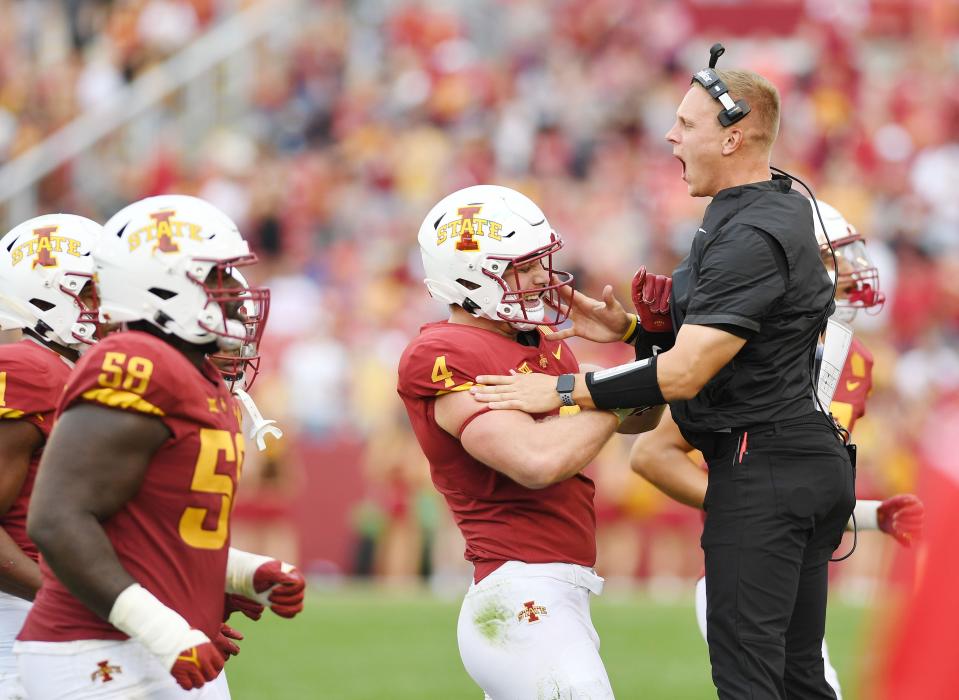 Iowa State Cyclones linebacker Colby Reeder (4) celebrates with an assistant coach after an interception against the Ohio Bobcats during the third quarter at Jack Trice Stadium Saturday, Sept. 17, 2022, in Ames, Iowa.