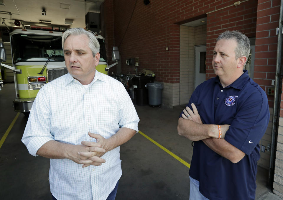 FILE - Timothy Stromsnes, left, then-president of the Reedy Creek Professional Firefighters, Local 2117, and then-union vice president Sean Pierce air concerns about the firefighting staff at Walt Disney World on May 28, 2019, in Lake Buena Vista, Fla. The local has been warning for years that they are understaffed and that poses a safety risk as the central Florida theme park resort grows bigger. (AP Photo/John Raoux, File)