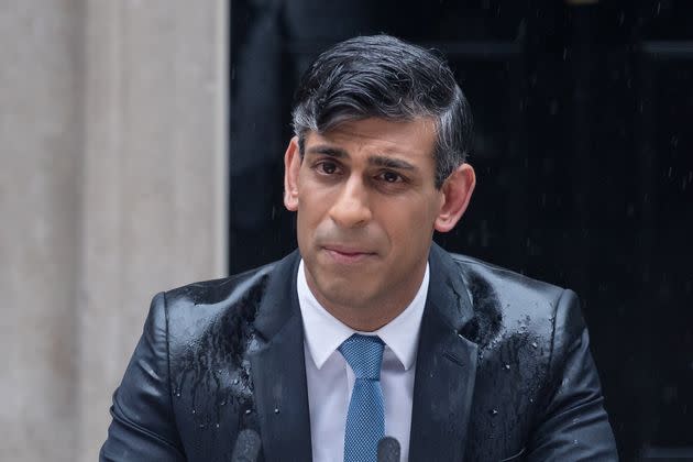 British Prime Minister Rishi Sunak makes a statement amid rain outside 10 Downing St. in London on May 22, announcing that the U.K. general election will take place July 4.