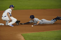 Tampa Bay Rays' Willy Adames is tagged out at second stealing by Los Angeles Dodgers shortstop Corey Seager during the second inning in Game 2 of the baseball World Series Wednesday, Oct. 21, 2020, in Arlington, Texas. (AP Photo/Tony Gutierrez)