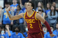 Southern California's Kobe Johnson (2) reacts after making a 3-point shot against UCLA during the first half of an NCAA college basketball game in the semifinal round of the Pac-12 tournament Friday, March 11, 2022, in Las Vegas. (AP Photo/John Locher)