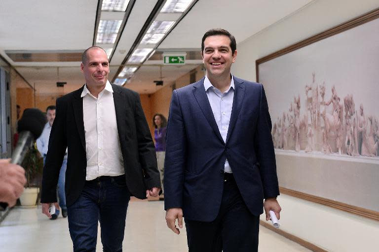 Greek Prime Minister Alexis Tsipras (R) and Finance Minister Yianis Varoufakis, pictured in Athens, after their meeting on May 27, 2015