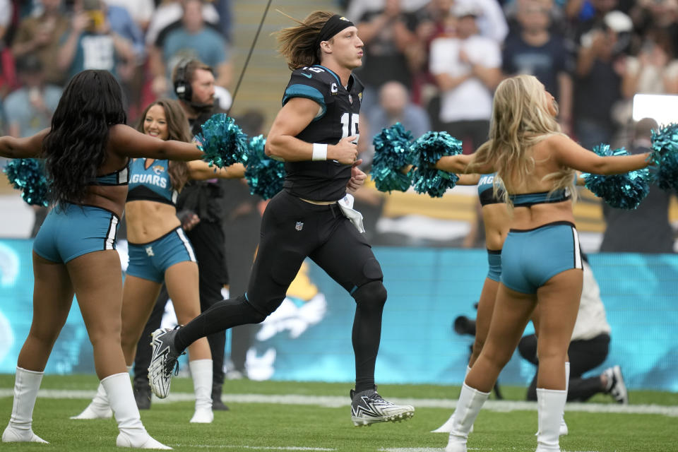 Jacksonville Jaguars quarterback Trevor Lawrence (16) runs onto the field for an NFL football game between the Atlanta Falcons and the Jacksonville Jaguars at Wembley stadium in London, Sunday, Oct. 1, 2023. (AP Photo/Kirsty Wigglesworth)