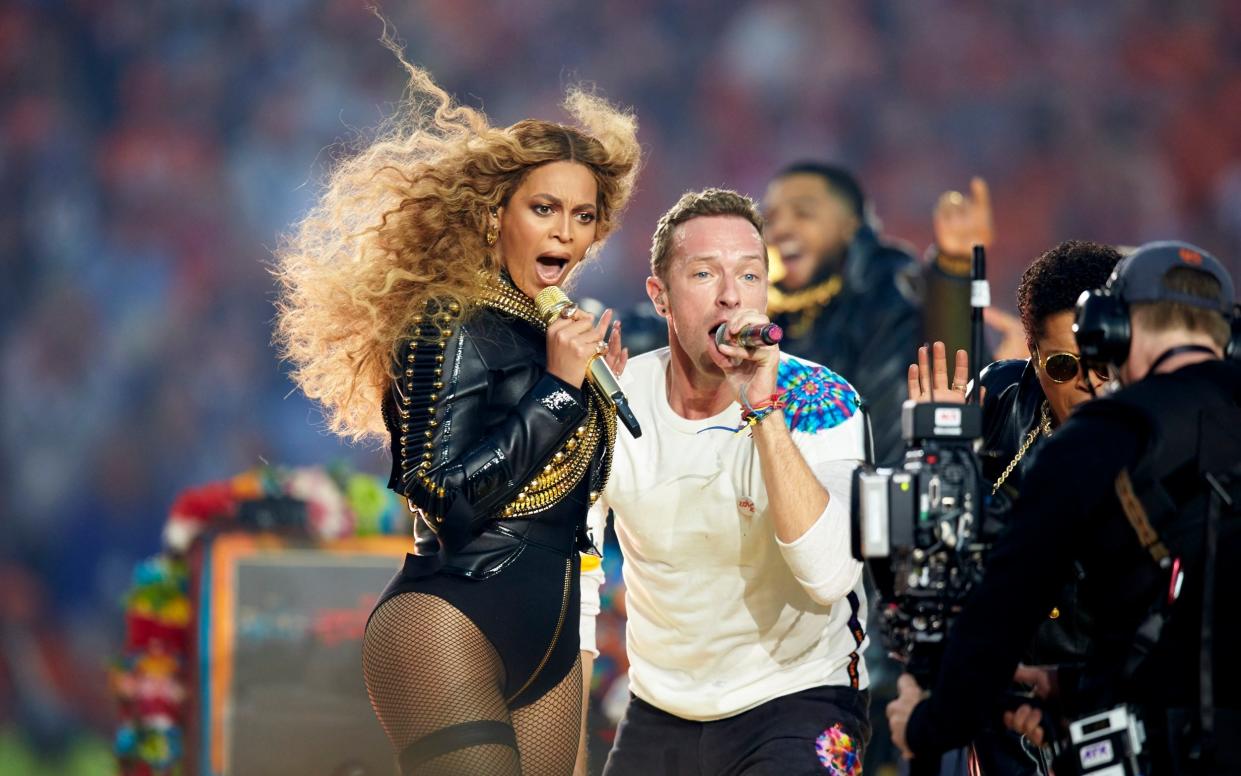 Beyoncé and Chris Martin performing in 2016