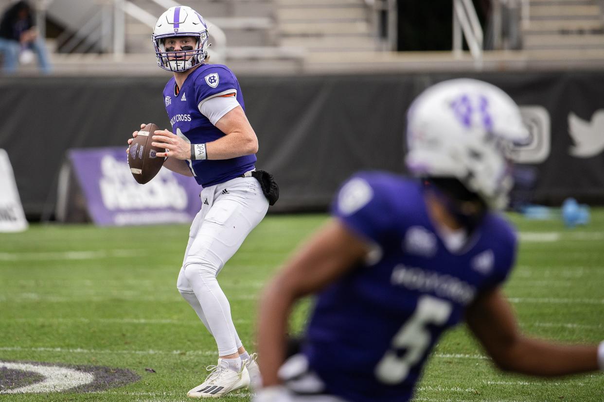 Holy Cross quarterback Matthew Sluka drops back to pass versus Colgate University on Saturday September 23, 2023 at Fitton Field in Worcester.