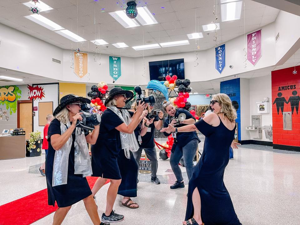 Principal Lana Shelton-Lowe, right, poses for paparazzi photos at Dogwood Elementary School’s Back to School Premiere event on Aug. 3, 2022.