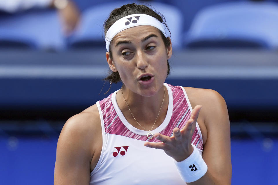 Caroline Garcia of France reacts after missing a shot against Zhang Shuai of China during a singles match in the Pan Pacific Open tennis tournament at Ariake Colosseum Wednesday, Sept. 21, 2022, in Tokyo. (AP Photo/Eugene Hoshiko)