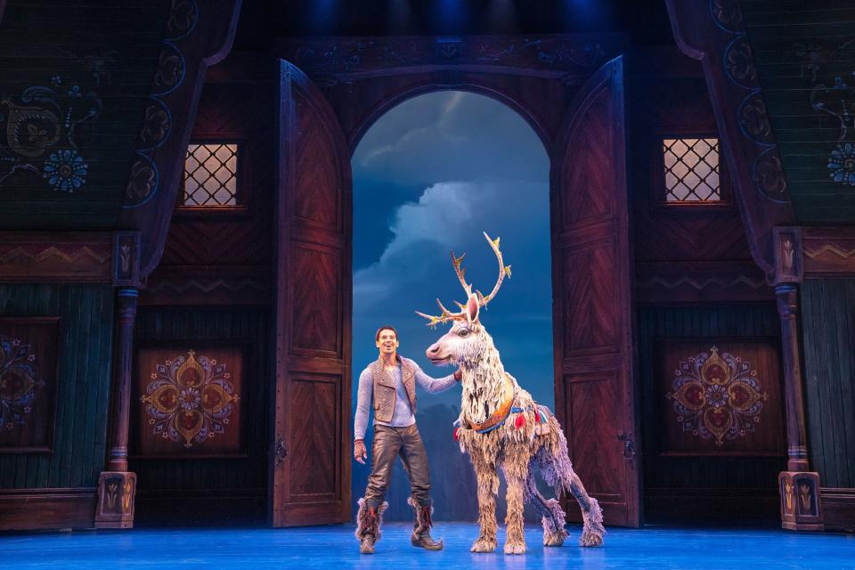 Ice, ice baby: Kristoff (Dominic Dorset) and his costume-puppet reindeer companion Sven pal around the permafrost in the stage production of "Frozen."