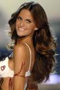 <p>Izabel Goulart pairs shiny curls with shiny lips in 2007.</p>