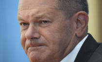 German Chancellor Olaf Scholz attends his first annual summer news conference in Berlin, Germany, Thursday, Aug. 11, 2022. (AP Photo/Michael Sohn)