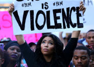 <p>A protester holds up a sign during a march through the streets to protest the police shooting of Keith Scott in Charlotte, N.C., on Sept. 24, 2016. (Mike Blake/Reuters)</p>