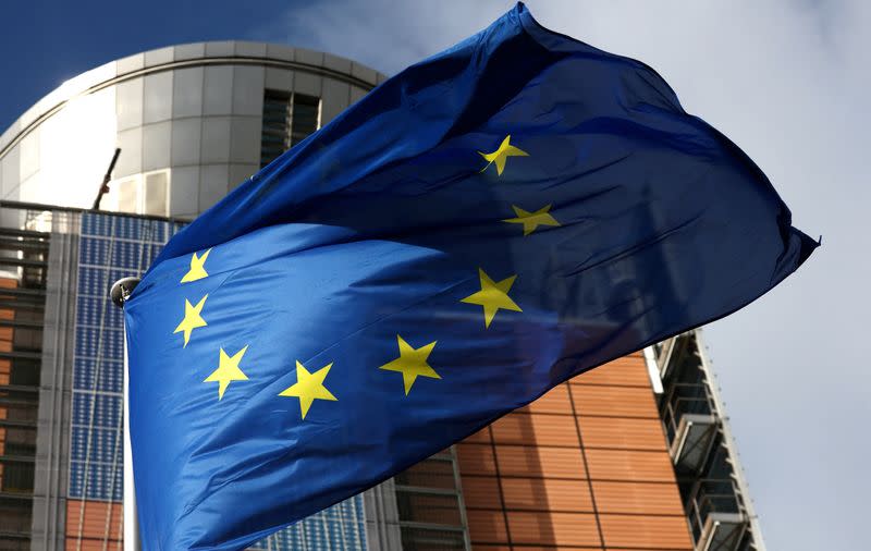 FILE PHOTO: A European Union flag flutters outside the EU Commission headquarters in Brussels