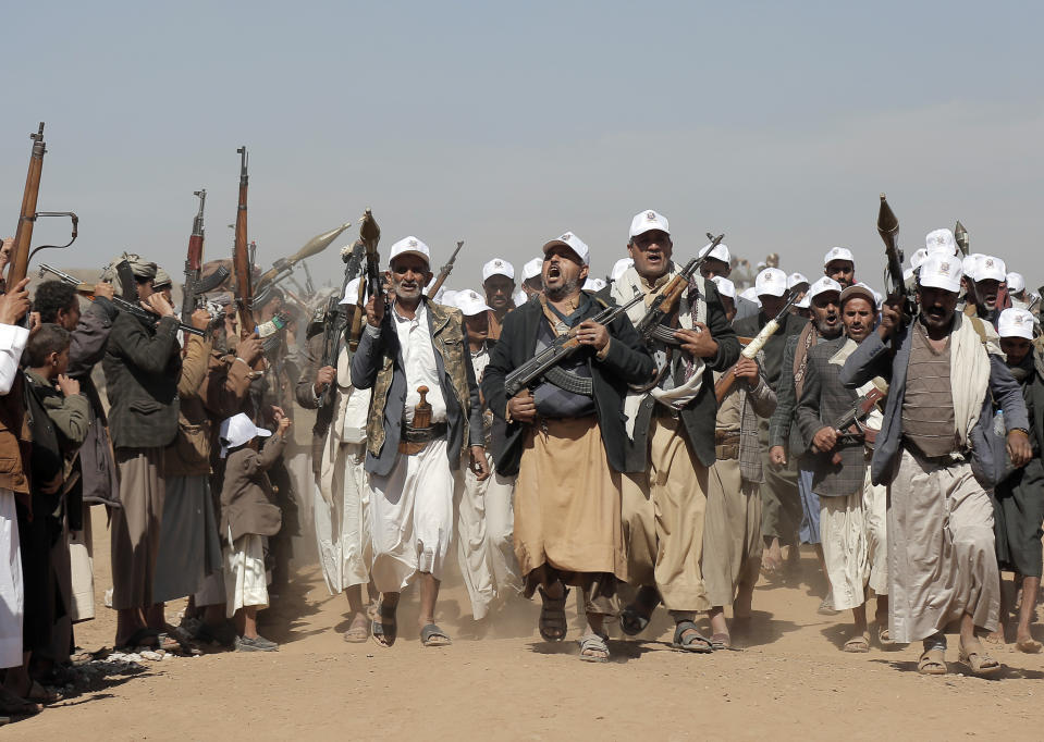 FILE - Houthi fighters march during a rally of support for the Palestinians in the Gaza Strip and against the U.S. strikes on Yemen outside Sanaa on Monday, Jan. 22, 2024. Thousands of fighters from Iran-backed groups in the Middle East are offering to come to Lebanon to join the militant Hezbollah group in its fight with Israel. (AP Photo, File)