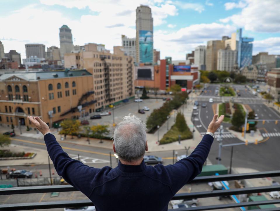 Vince Paul, president and artistic director of Detroit's Music Hall, looks over the empty lot next door where a modern music complex will be constructed.