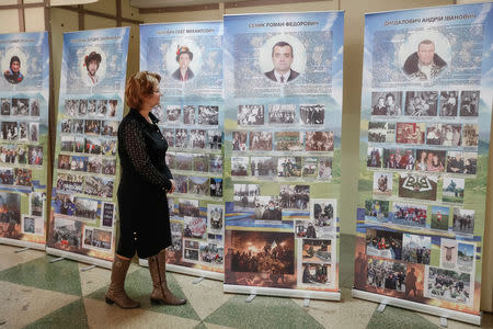 FILE PHOTO: Lesya Senyk, a sister of a 51-year-old kindergarten director Roman, was one of those killed on Maidan, a protest sparked by Yanukovich's decision to renege on signing a political and trade agreement with the EU after pressure from Moscow in 2014, is seen in Dubliany, Ukraine March 13, 2019. REUTERS/Gleb Garanich