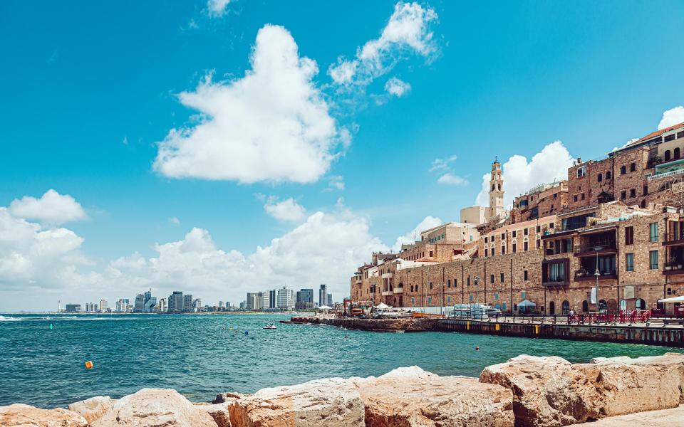 Old Jaffa and a distant view of modern Tel Aviv - getty