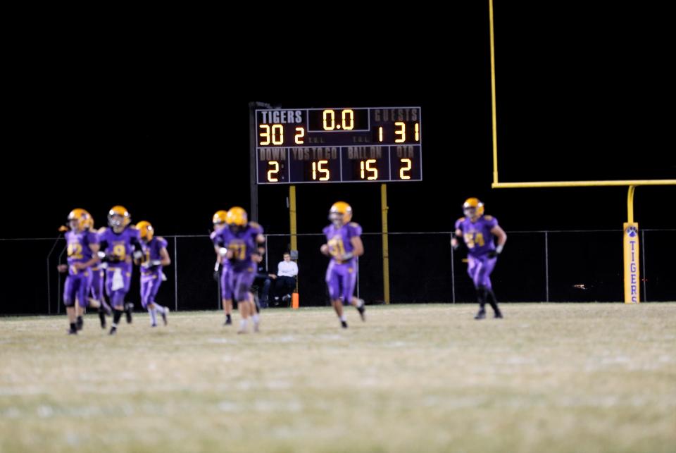 The Hagerstown Tigers run off the field after the first half of a sectional championship game against Sheridan Nov. 4, 2022.