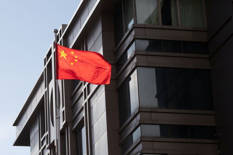 China’s national flag is seen waving at the China Consulate General in Houston, Texas