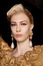 <p>Focus on the glamour, rather than the gilding with Moschino's Upper East Side updo. </p>