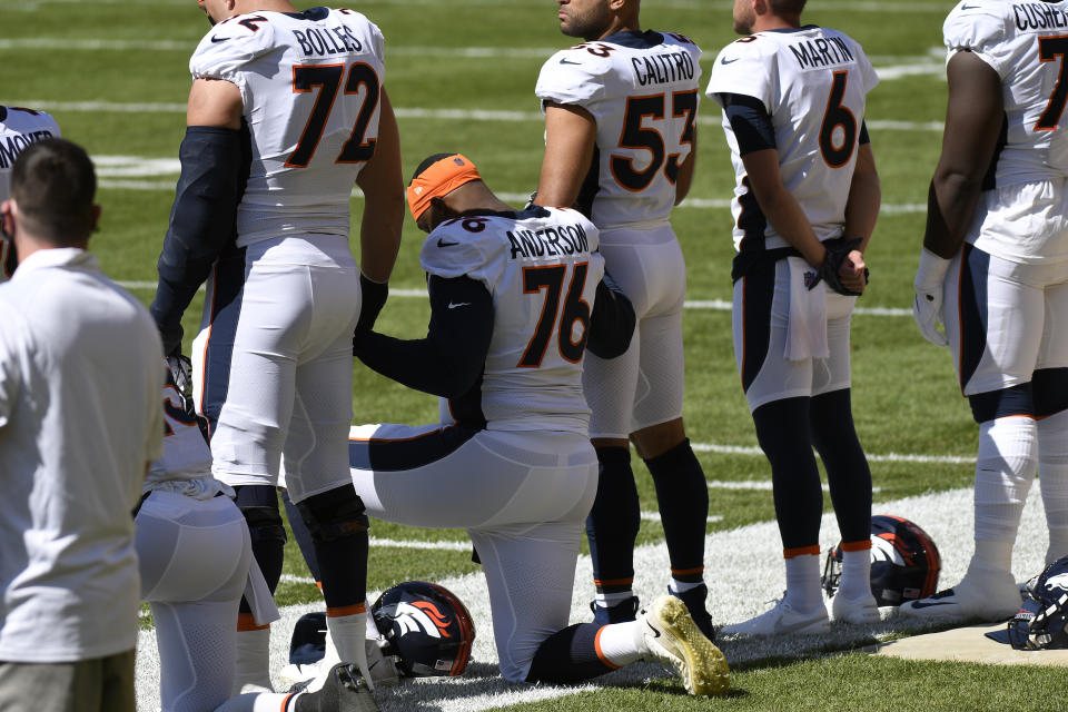 Denver Broncos offensive tackle Calvin Anderson (76) kneels during the national anthem before an NFL football game against the Pittsburgh Steelers in Pittsburgh, Sunday, Sept. 20, 2020. (AP Photo/Don Wright)