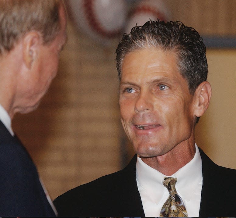 Former Major League Baseball great Brett Butler visits with someone during his visit in 2003 to Bartlesville as part of the American Legion World Series activities.