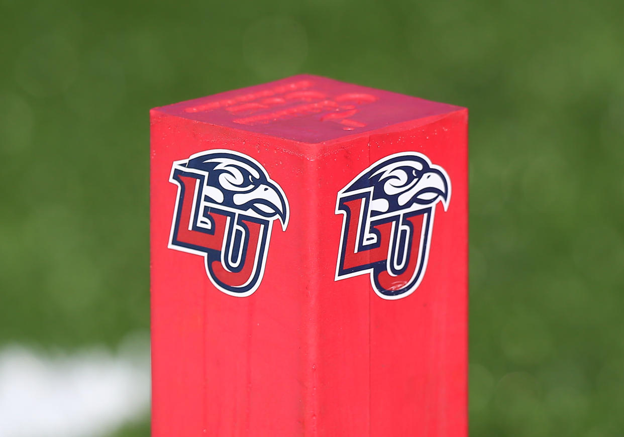 LYNCHBURG, VA - NOVEMBER 19: Liberty Flames pylon with logo resting on a turf field during a college football game between the Virginia Tech Hokies and the Liberty Flames on November 19, 2022, at Williams Stadium in Lynchburg, VA. (Photo by Lee Coleman/Icon Sportswire via Getty Images)