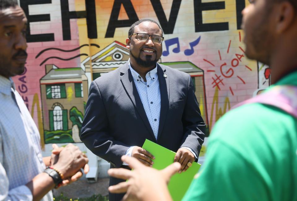 Michael Harris, executive director of the Greater Whitehaven Economic Redevelopment Corporation, attends an unveiling of a new mural by local artist Tony Hawkins at the Whitehaven Community Center on Friday, June 3, 2022.