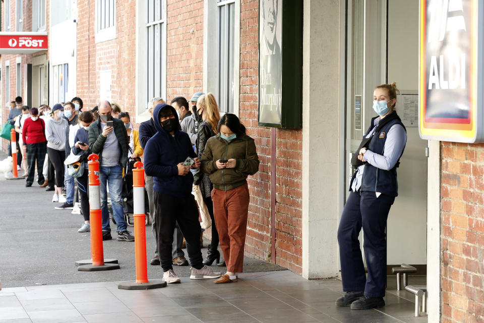 MELBOURNE, AUSTRALIA - AUGUST 02: Large crowds of people are seen standing in line to enter a supermarket in South Melbourne on August 02, 2020 in Melbourne, Australia. Public concern has increased as speculation grows that Premier Daniel Andrews will introduce further restrictions in his daily briefing (Photo by Darrian Traynor/Getty Images)