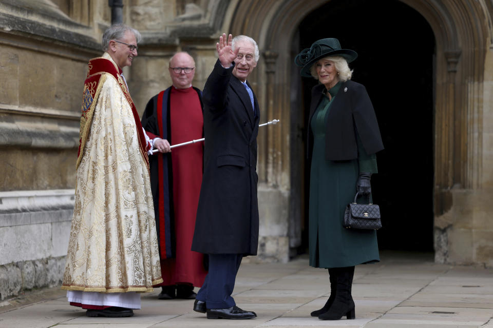 Britain's King Charles III, center, and Queen Camilla arrive to attend the Easter Matins Service at St. George's Chapel, Windsor Castle, England, Sunday, March 31, 2024. (Hollie Adams/Pool Photo via AP)