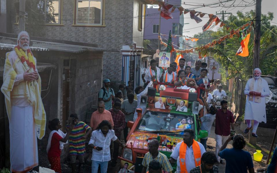 Narendra Modi supporters - with cardboard cutouts of the BJP leader - campaigning in Chennai, southern India