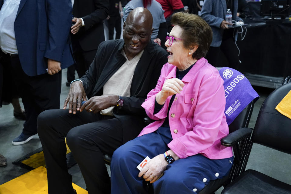 Michael Cooper and Billie Jean King sit courtside before a WNBA basketball game between the Phoenix Mercury and the Los Angeles Sparks in Los Angeles, Friday, May 19, 2023. (AP Photo/Ashley Landis)